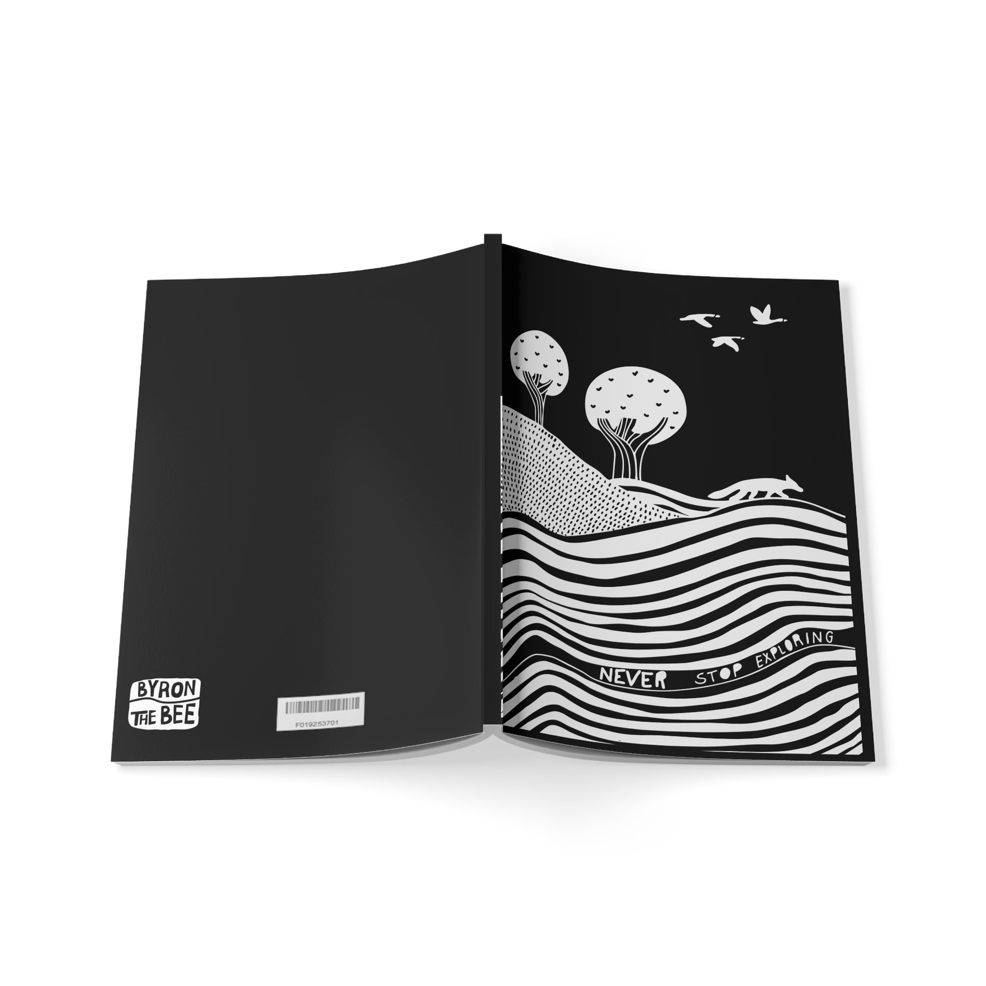 Open book with black and white illustration of a landscape and text on a white background