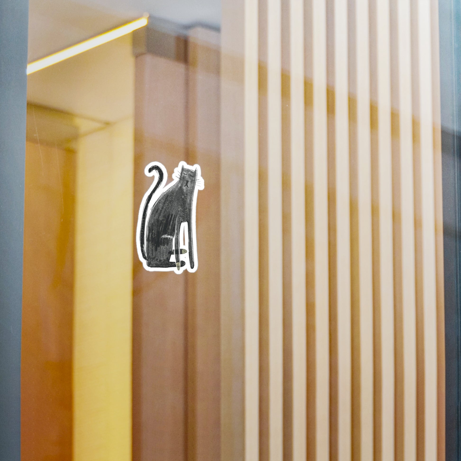 Black and white cat illustration on a glass surface with vertical wooden slats in the background